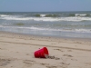 red-bucket-in-the-sand