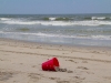 red-bucket-in-the-sand